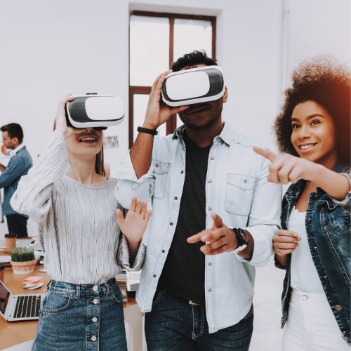 Small group of people standing up at a business event, using virtual reality headsets