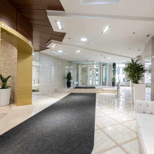 free venue finding for HR, represented by a bright, modern hotel lobby area